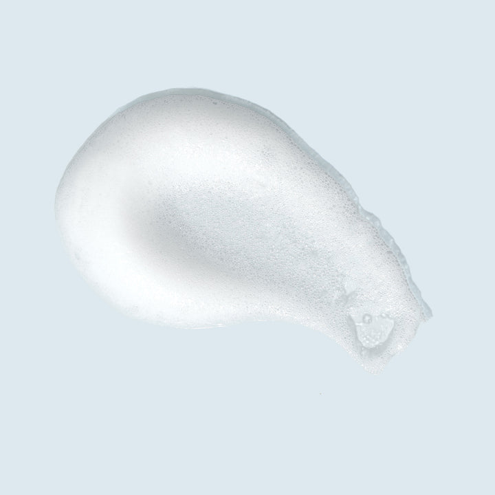 TiZO Foaming Cleanser swatch on light blue background.