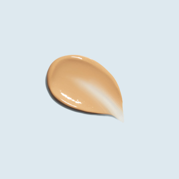 TiZO Mineral Sun Defense swatch on light blue background.