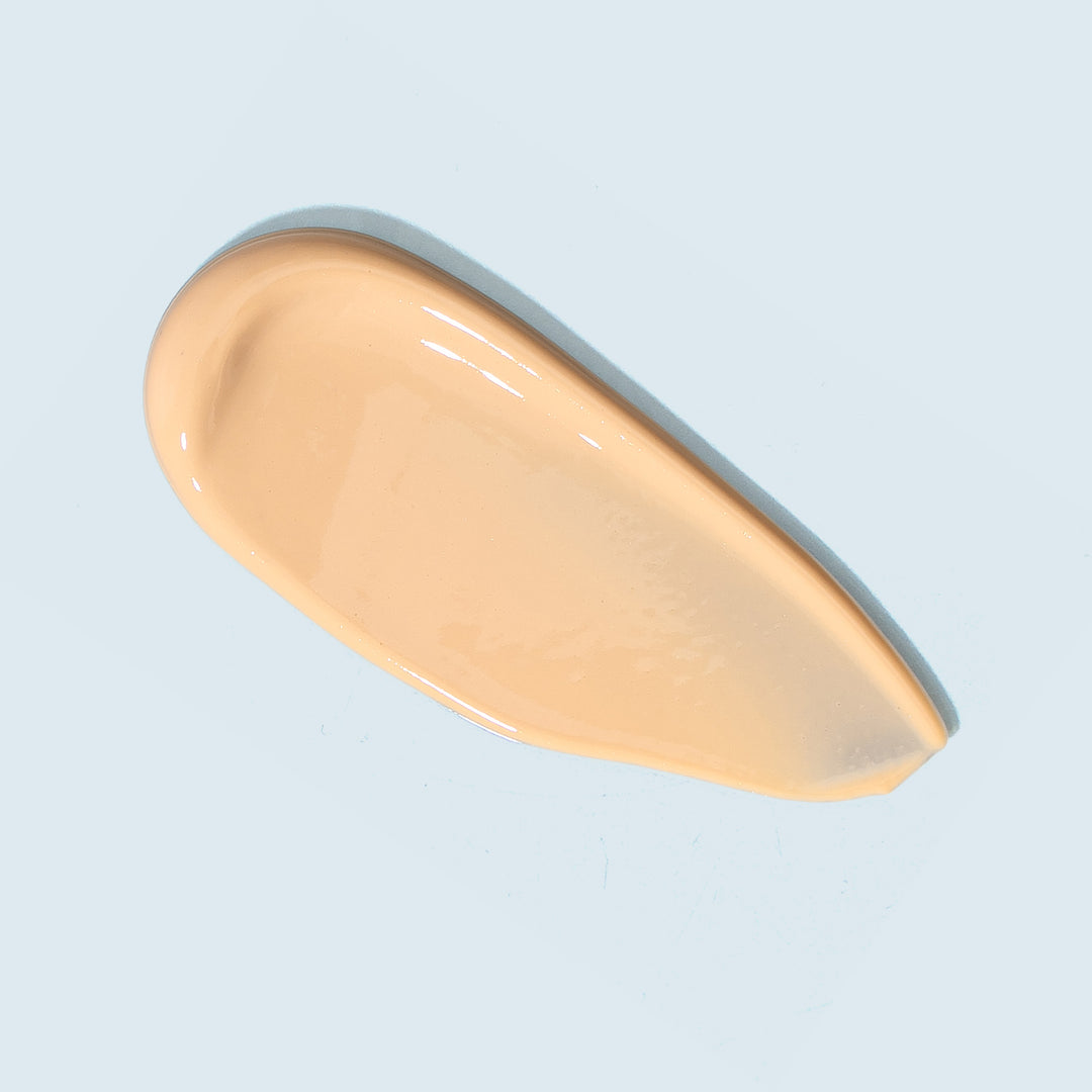 TiZO Ultra Zinc Tinted swatch on light blue background.