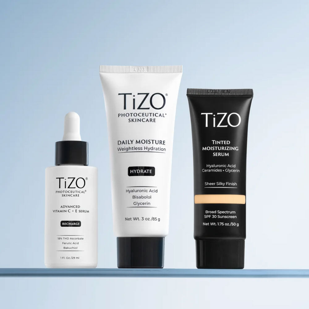 Tizo product line up of Vitamin C serum, Tizo Daily moisture and Tizo tinted moisturizing serum on a blue gradient background