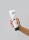 hand holding TiZO gentle amino gel cleanser